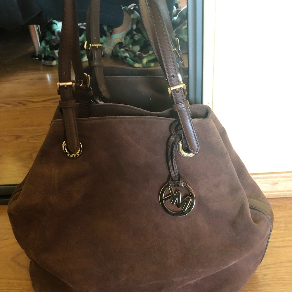 3 Michael Kors handbags